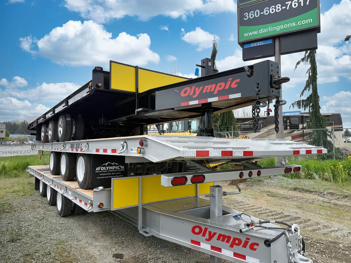 Olympic trailer in a Darling Sons equipment yard